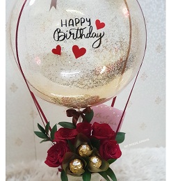 5 Red rose 5 ferrero Rocher chocolates in basket with Printed balloon Happy BirthDay