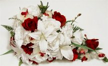 White lilies white orchids Red Roses in Hand Bunch