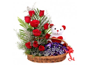 4 Dairy Milk 6 Inch Teddy with 10 red roses in the same basket