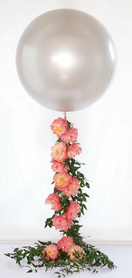 Transparent Balloon with 12 pink roses climbing on the stick of the balloon