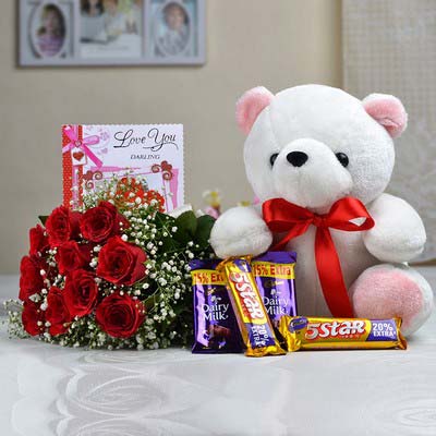 12 red Roses bouquet with a 6 inches Teddy and 5 dairy milk chocolates