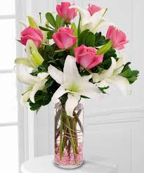 Dozen Pink roses and white Liliums in a Vase