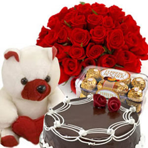 MIDNIGHT Dozen red Roses and 16 Ferrero Rocher Chocolates 1/2 Kg cake Teddy