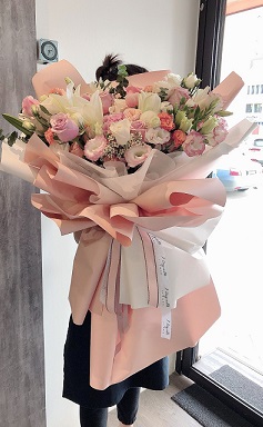 Life Size Pink White and Peach Flowers Bouquet wrapped in paper