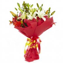 White Liliums bouquet with red wrapping