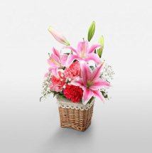 Short stems of 3 Pink lilies 5 red carnations basket