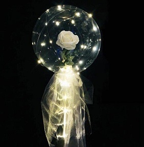 White rose inside a transparent Luminous balloon with white Wrapping